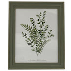 Straight-on view of the photo frame showing its squared, layered green-grey border around a printed arrangement of leafy stems.