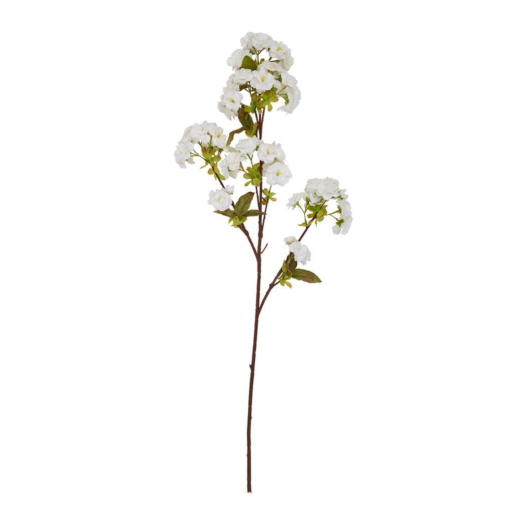 Full view of an artificial blossom stem with a long brown stalk, branching clusters of white flowers and green leaves against a white background.