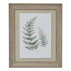 Front view of Two Fronds artwork with two green ferns on white, a beige mount and a pale wood-grain-look rectangular frame.