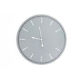 Front view of a round grey wall clock with white baton hour markers and shaped white hands.