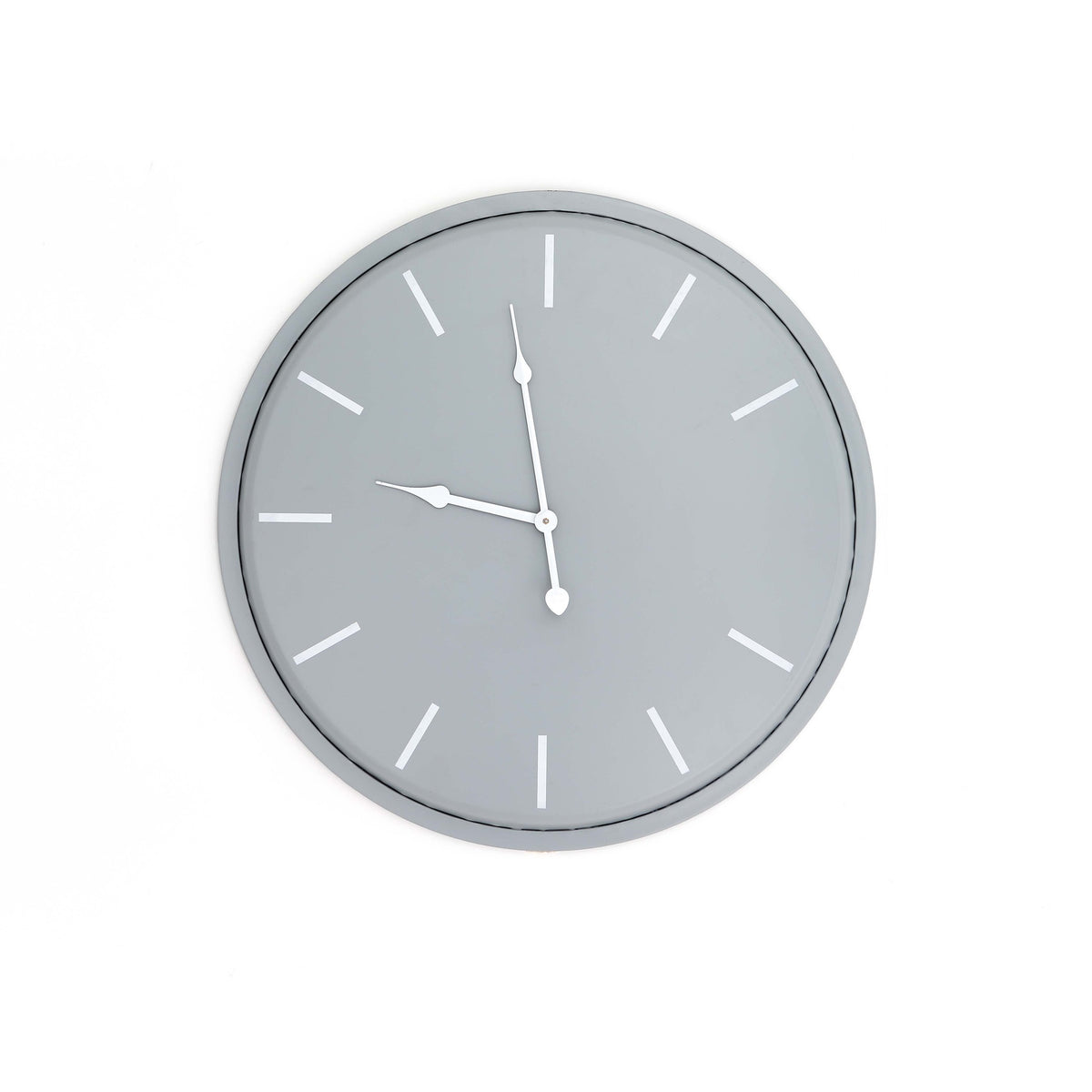 Front view of a round grey wall clock with white baton hour markers and shaped white hands.