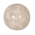 Cream-toned decorative ball with pale grey floral scrolls, fine warm-toned crackle-like lines and glossy reflections against a white background.