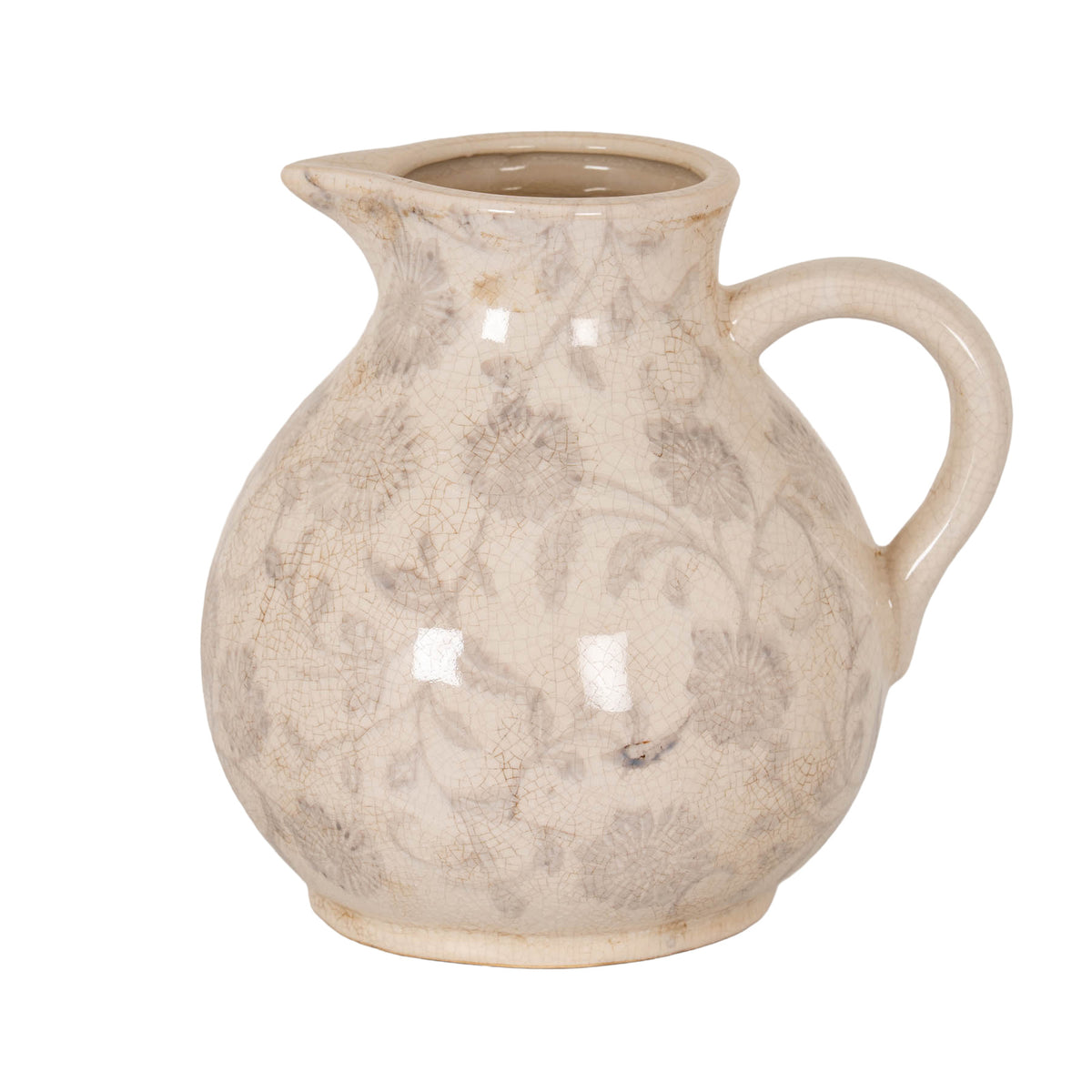 Cream decorative jug with grey flowers and scrolling stems, fine brown crackle-like lines, a pouring lip on the left and a thick loop handle on the right.