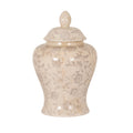 Pale ginger jar with grey flowers and curling stems, rounded shoulders, a flared foot and a domed lid topped by a pointed finial, against a white background.