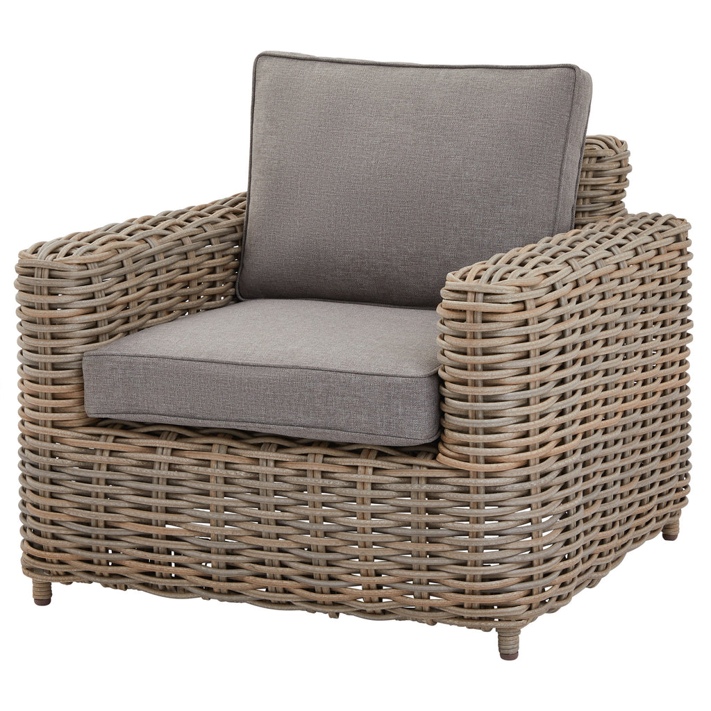Grey woven armchair with broad rounded arms, a pale grey seat cushion and a matching edged back cushion against a white background.