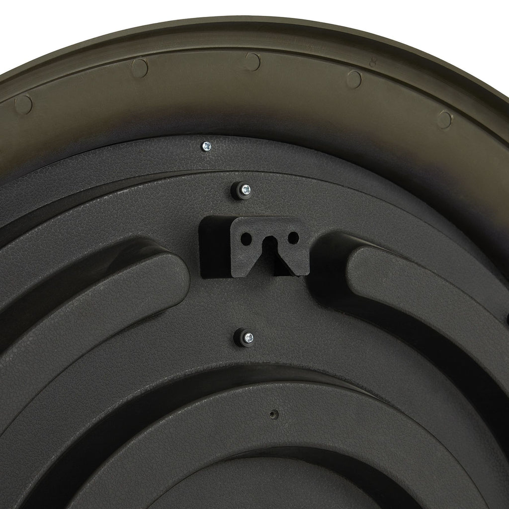 Close-up of the clock's dark rear backing, showing curved raised ribs, screws and a central hanging bracket with a keyhole-shaped opening.