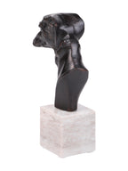 Rear three-quarter view showing the shaped back of the greyhound’s head and neck on its pale marble base.