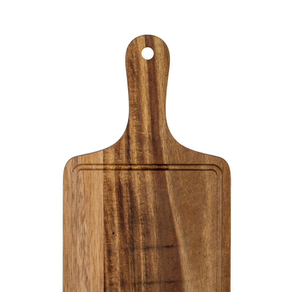 Close view of the board's rounded handle and circular hanging hole, with curved shoulders, the upper groove and varied dark and golden brown grain.