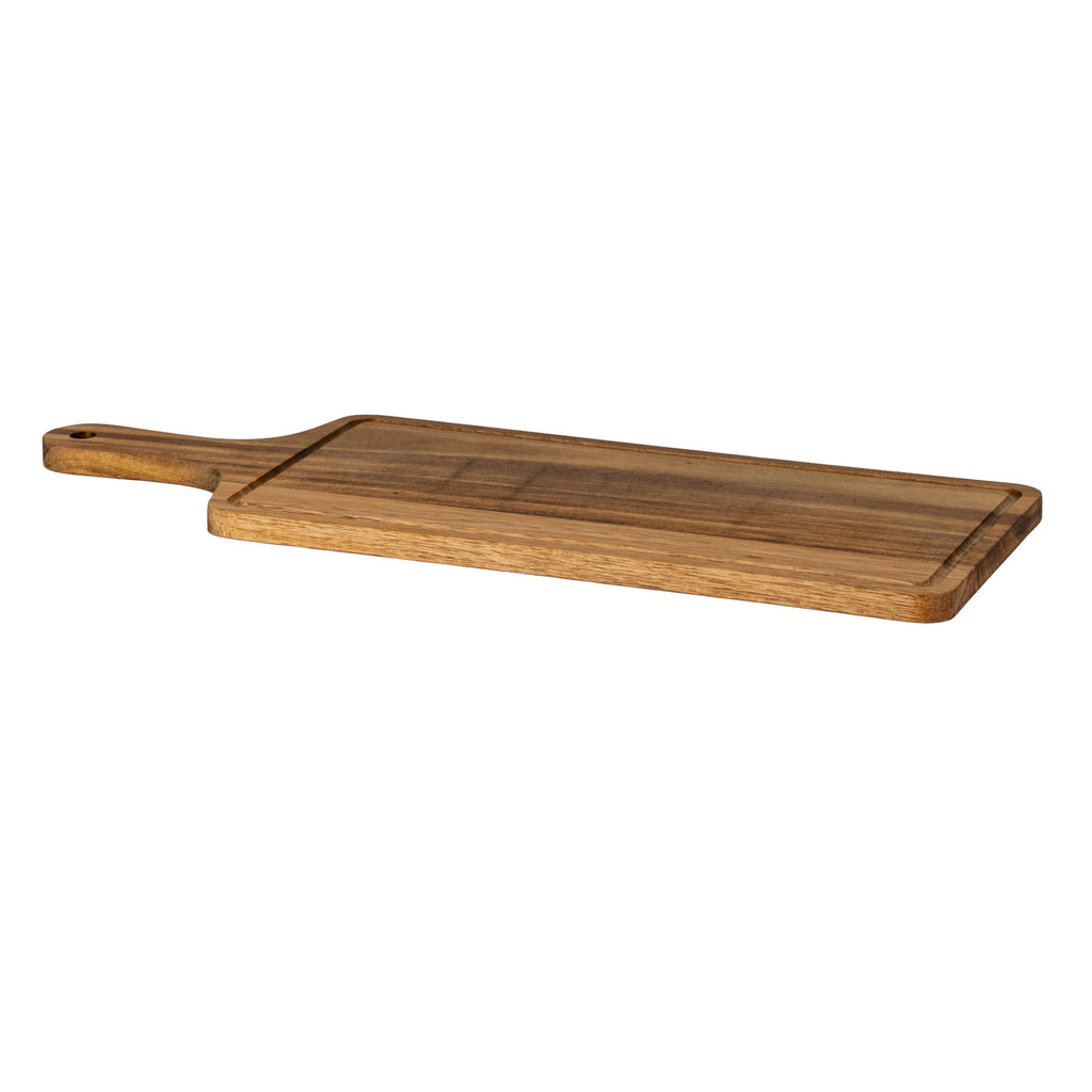Low angled view of the serving board with its handle extending left, showing the thin edge, rounded corners and recessed perimeter groove.