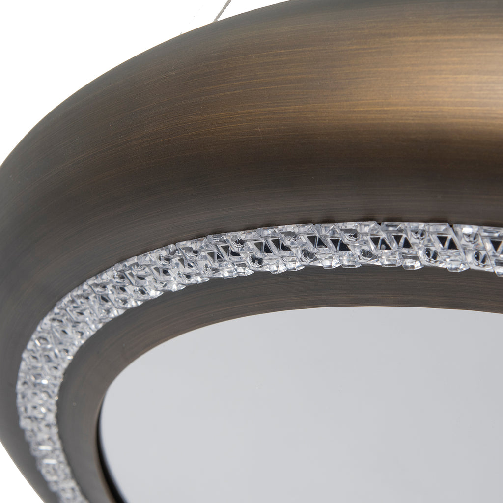Close-up of the ring's streaked antique finish and clear faceted crystal detail along the inner curve.
