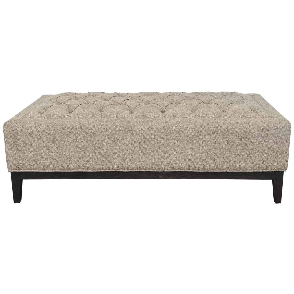 Taupe rectangular ottoman on a white background, showing its buttoned top, raised border and dark wooden frame.