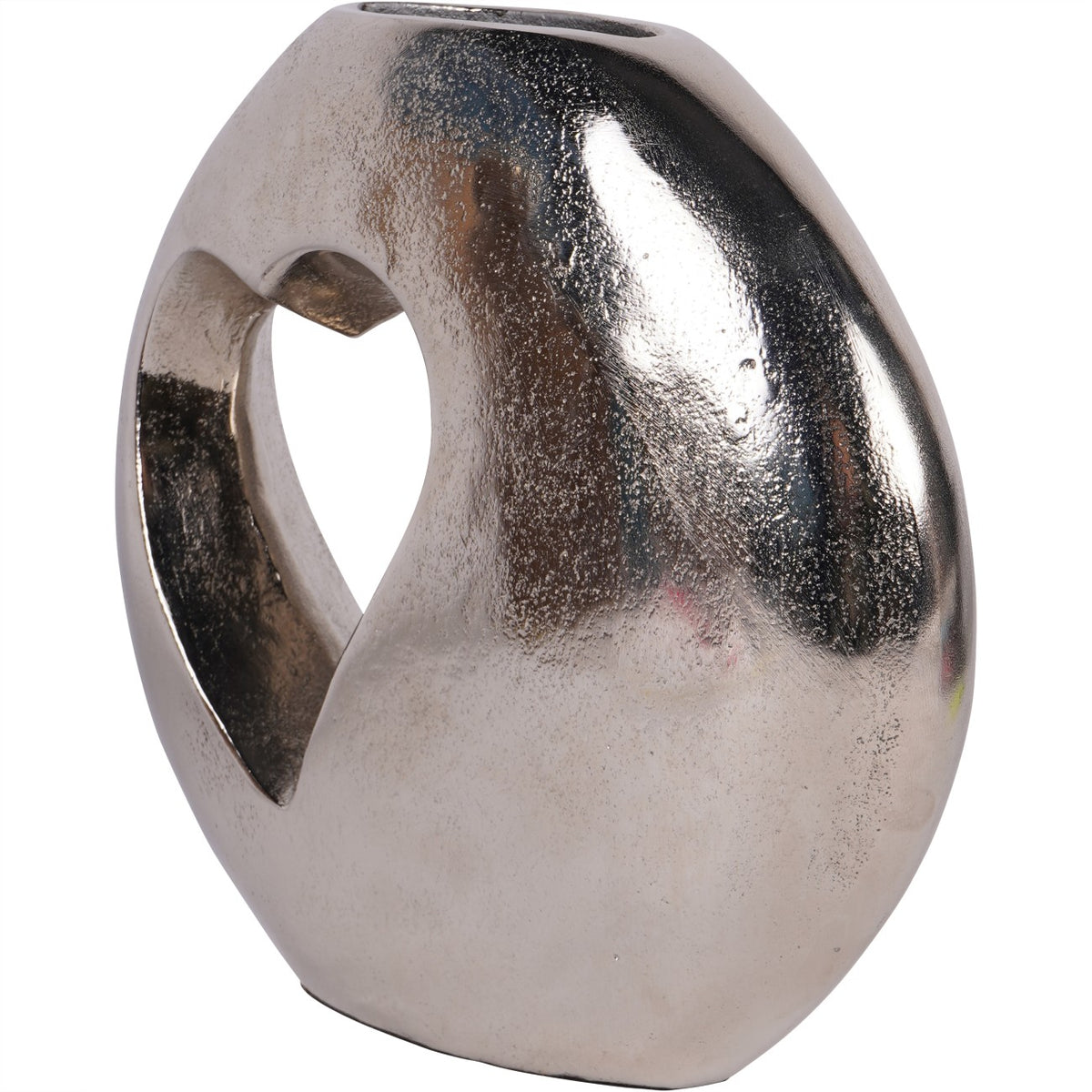 Angled view of the silver vase showing its flattened profile, heart opening and narrow top slot.