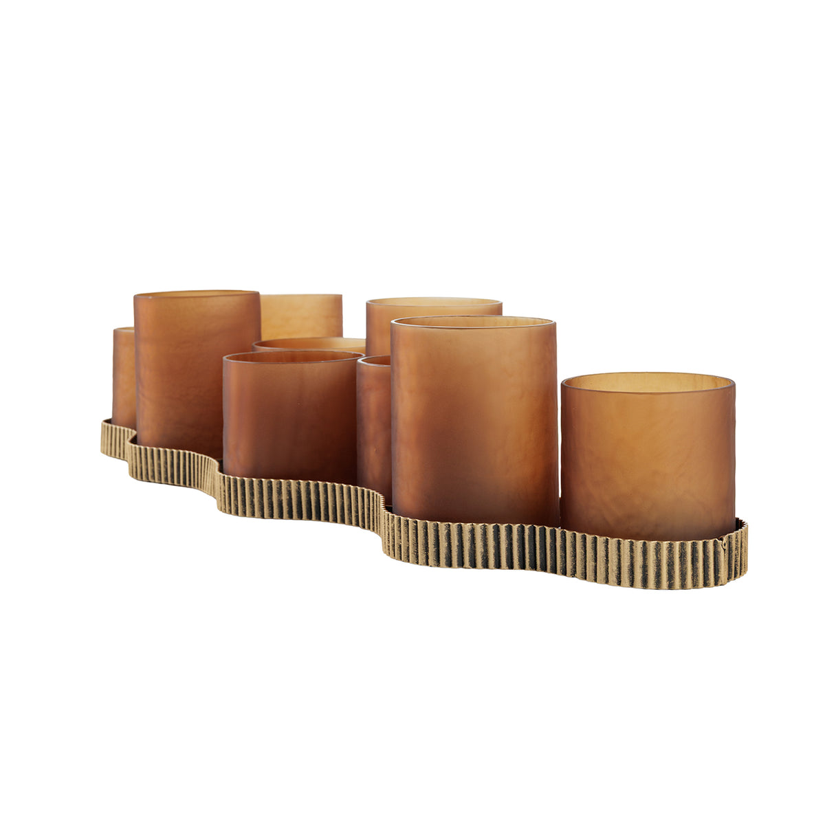 Angled view of the candleholder showing staggered glass cylinders and the curved outline of the ribbed gold base.