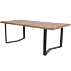 Three-quarter view of a rectangular wooden dining table with a patterned top and two angular black leg frames.