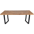 Elevated view of the dining table showing the herringbone wood pattern within a straight border and black metal legs.