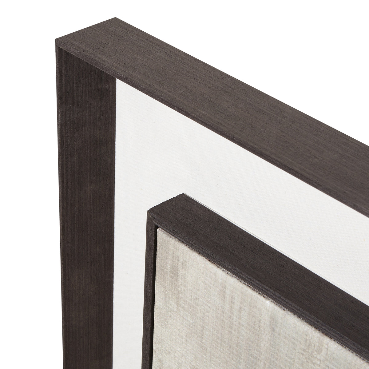 Close-up of the artwork's upper frame corners, showing the streaked dark finish, broad pale mount and textured pale image surface.