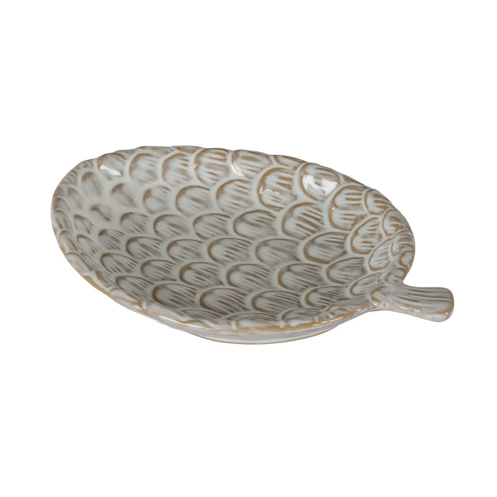 Cream pinecone-shaped decorative dish viewed from above at an angle, showing tan-brown incised scales and a short stem extending to the right.