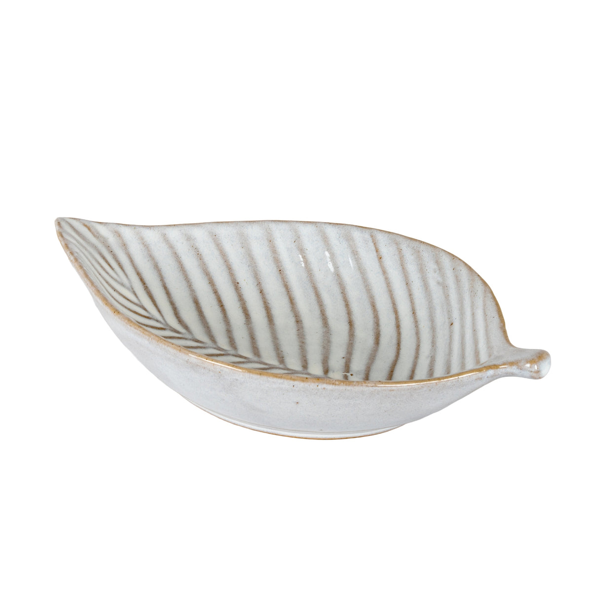Angled view of the off-white leaf-shaped dish, showing its curved sides, pointed left tip and short stem on the right.