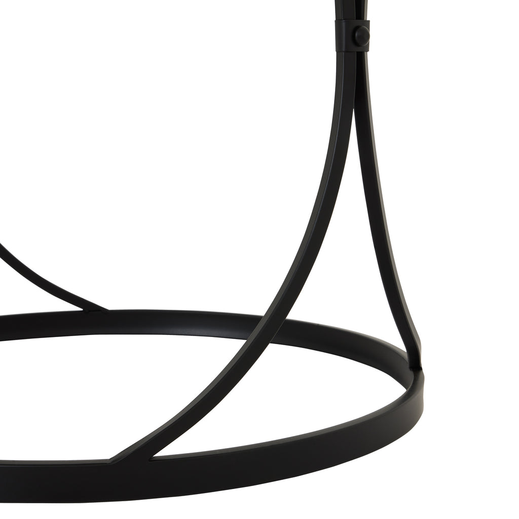 Detail of the black inward-curved supports, a round fastener at their crossing and the circular base ring below.