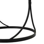 Detail of the black inward-curved supports, a round fastener at their crossing and the circular base ring below.
