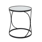 Single round side table showing its mirrored top, crossing black supports and circular base ring against white.
