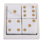 Overhead view of four marble dice in their matching box, showing one, six, four and three brass-coloured pips on the upper faces.