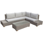 Grey-beige woven L-shaped seating with pale seat and back cushions, extended end platforms and a rectangular coffee table against a white background.