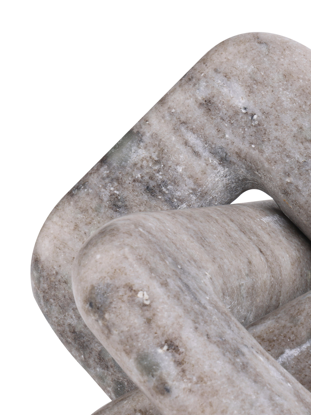 Close-up of a rounded corner and crossing loops, showing pale beige marble with darker flecks and markings.