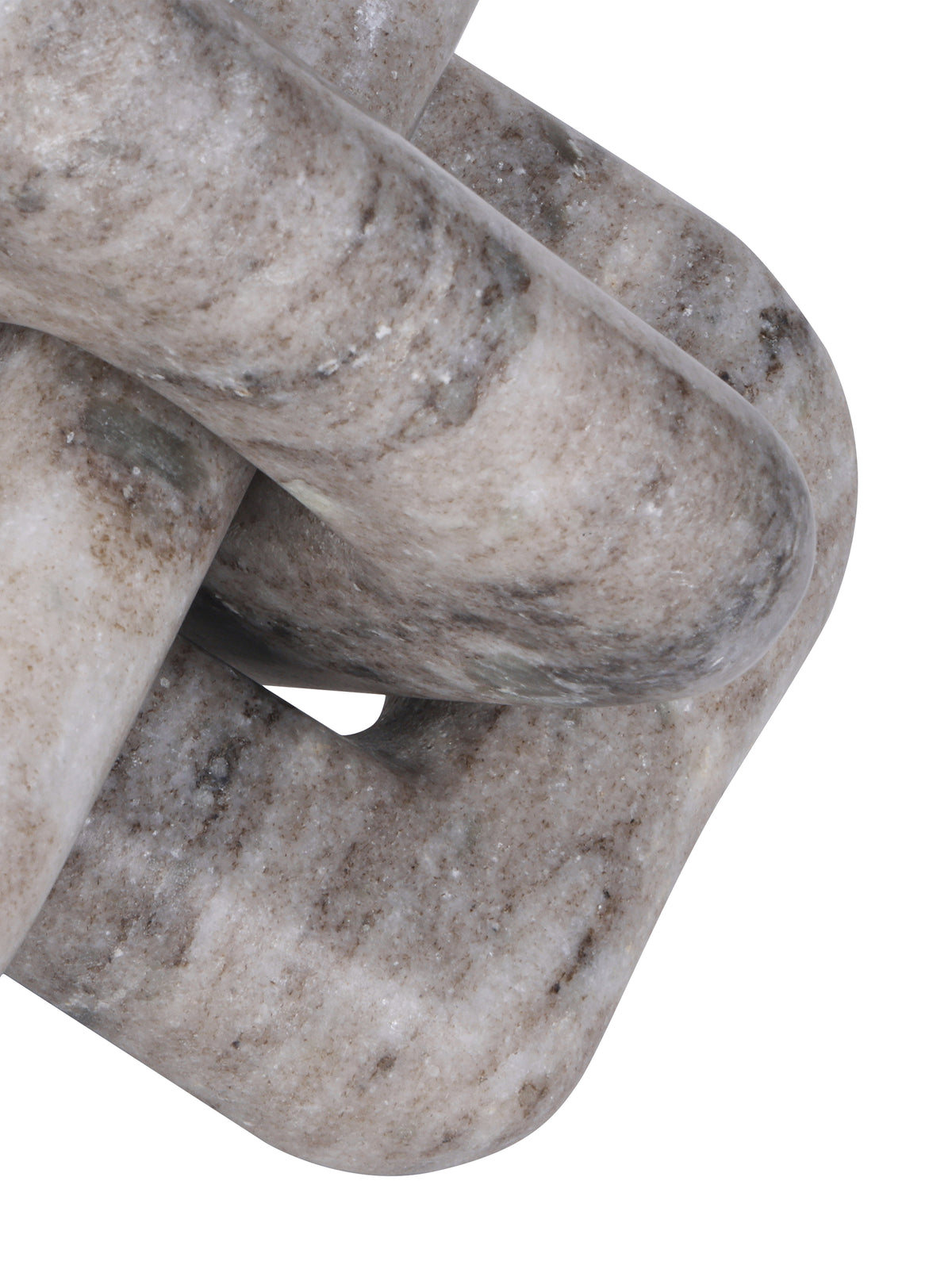 Detail of the knot sculpture's curved marble surfaces and a small opening between two interlocking loops.