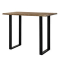 Irregular Edgeframe Bar Table viewed at an angle, showing a pale brown rectangular top with uneven long edges and two black open end frames.
