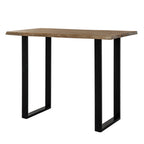 Irregular Edgeframe Bar Table viewed at an angle, showing a pale brown rectangular top with uneven long edges and two black open end frames.