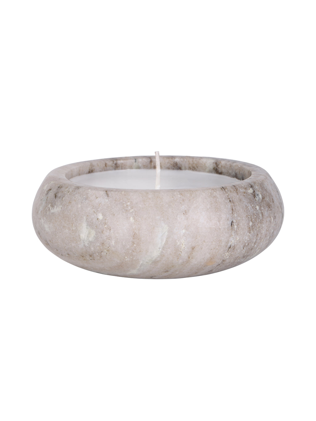 Side view of the beige marble candle, showing its curved body, natural markings and wax below the rounded rim.