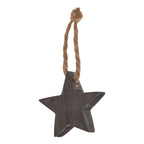 Charcoal hanging star shown at an angle, revealing its textured face and thick edge beneath a knotted tan loop.