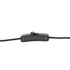 Close-up of a black inline rocker switch on the lamp cable against a white background