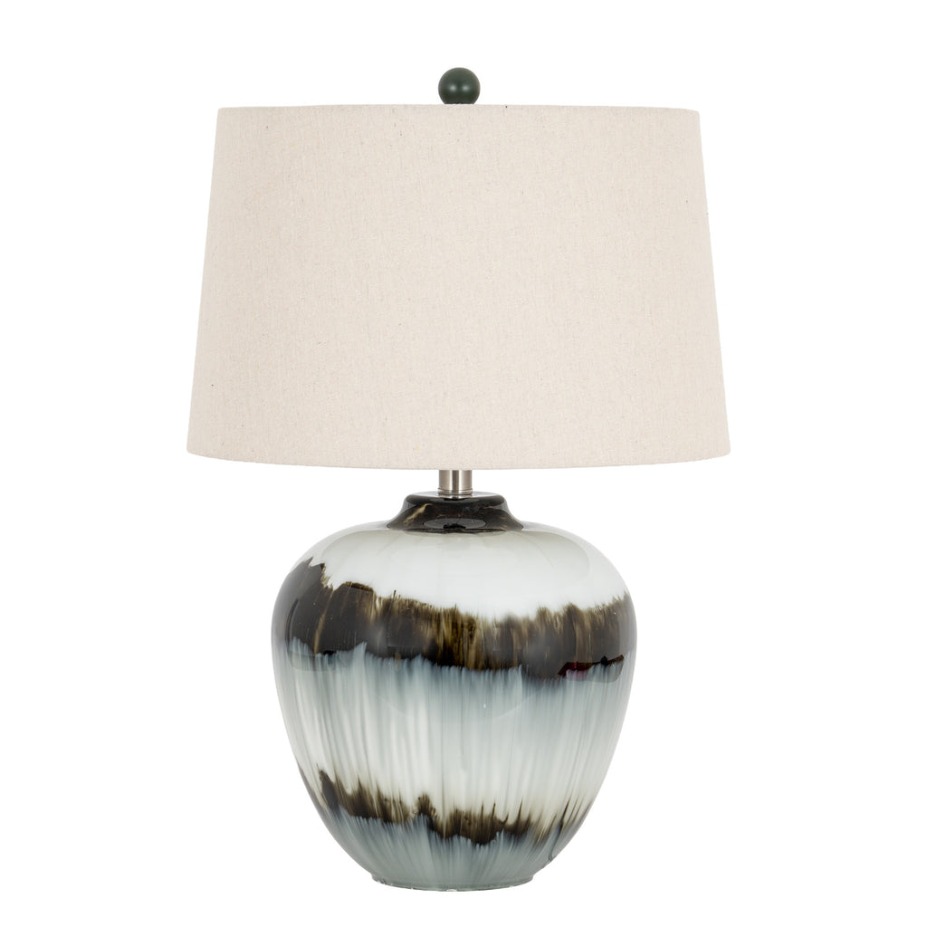 Table lamp with a pale glossy rounded base, two irregular dark bands, an off-white tapered shade and a dark ball finial against white.