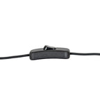 Close-up of a black rectangular in-line rocker switch on the lamp's black flex against a white background.