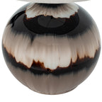 Close-up of the glossy lamp body showing feathered cream and smoky taupe bands bordered by near-black, beneath the shade edge.