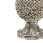 Detail of the lower pinecone scales above a curved pedestal with mottled grey-white colouring and golden marks.
