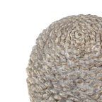 Close-up of the pinecone ornament's rounded top, showing overlapping grey-white scales with warm golden edges.