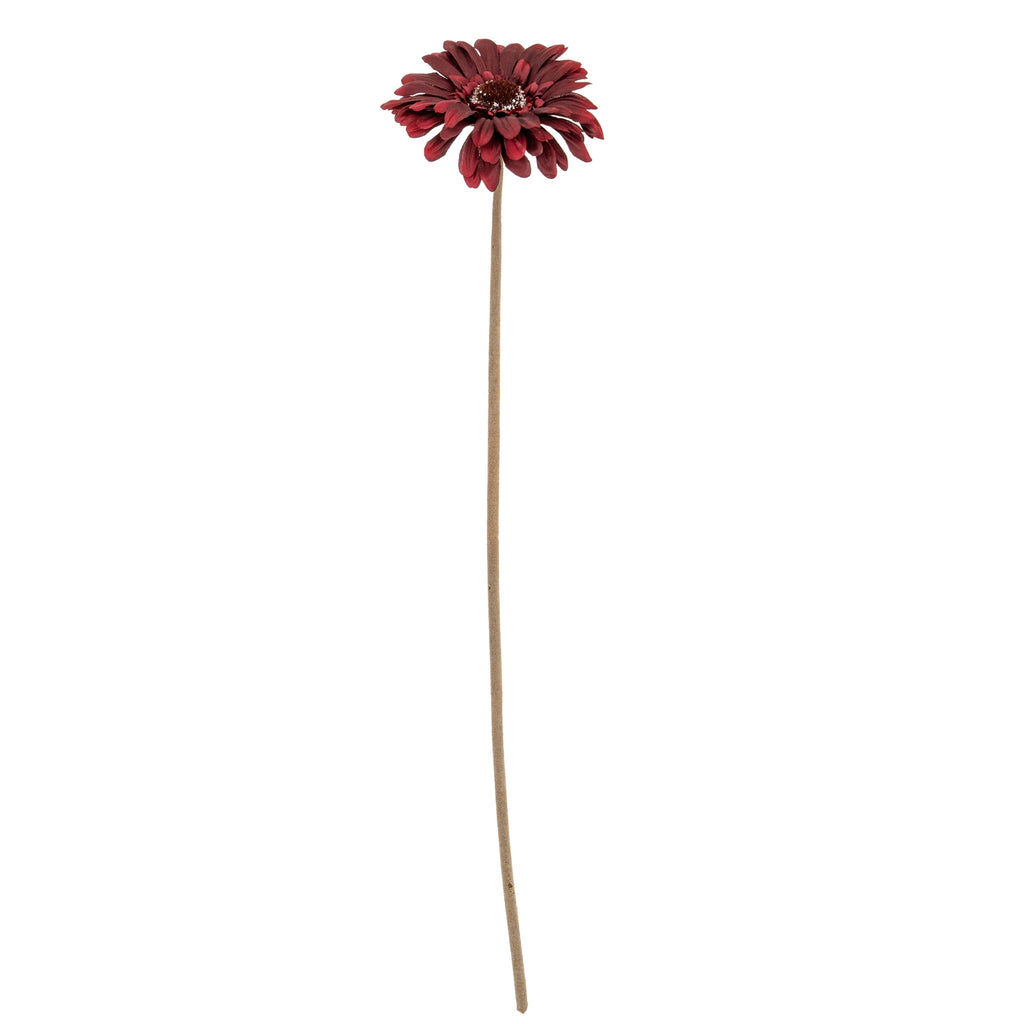 Full view of a burgundy artificial flower with overlapping petals on a long, slender green-brown stem against white.