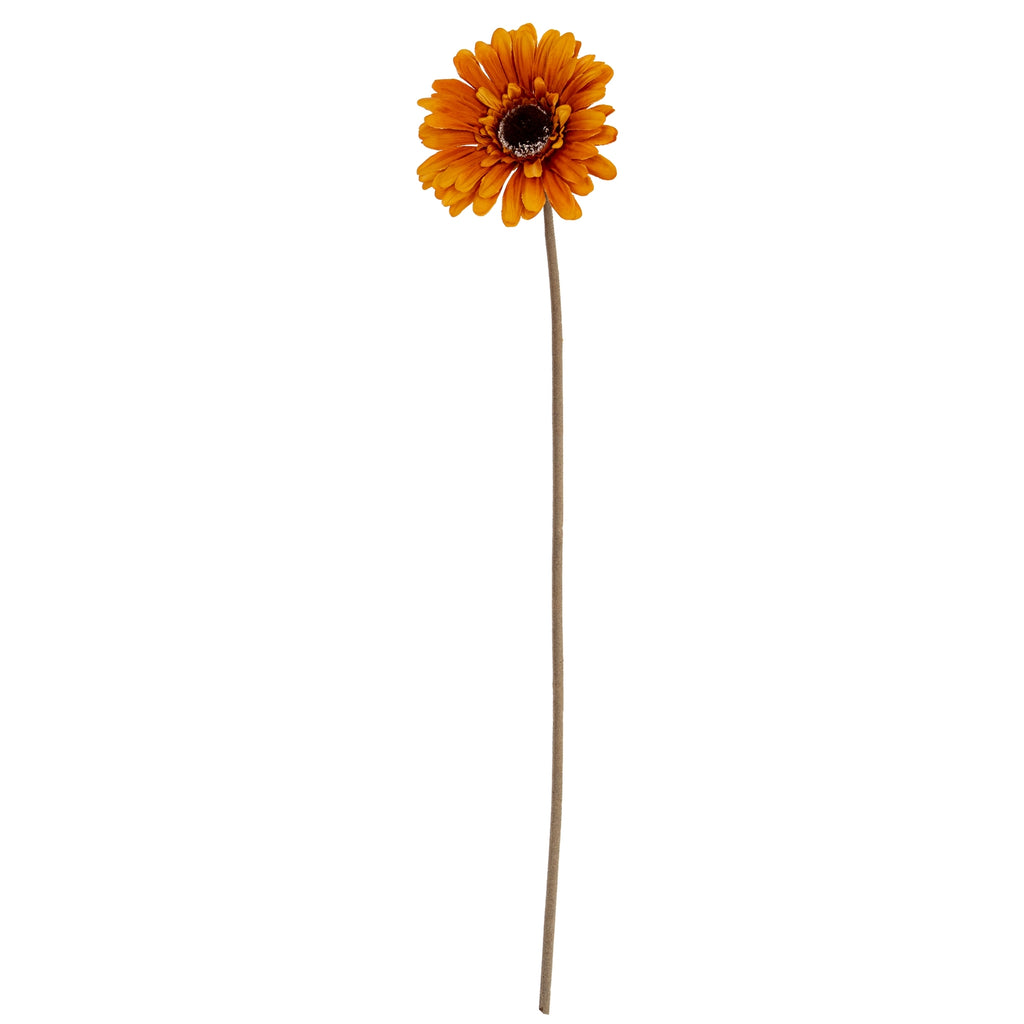 Golden-orange artificial flower shown in full, with layered petals, a dark centre and a long slender green-brown stem against white.