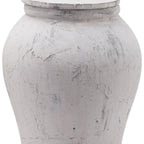 Close-up of the ginger jar's curved body and lid edge, showing irregular crackled markings and darker grey scuffs in the pale finish.