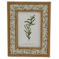 Front view of the Leafprint Doubletrim photo frame, with warm brown inner and outer trim, a pale leaf-patterned border and a botanical display insert.