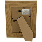 Rear view of the photo frame with its fold-out stand, two hanging loops and a product label warning: Do not hang or place this item above or near a heat source.