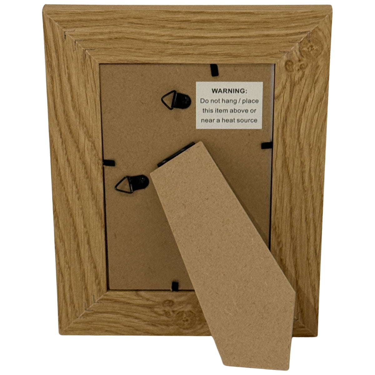 Rear view of the photo frame with its fold-out stand, two hanging loops and a product label warning: Do not hang or place this item above or near a heat source.