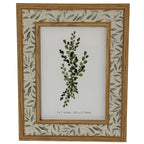 Front view of the Leafprint Doubletrim photo frame with warm wood-tone edges, a pale leaf-patterned border and a botanical insert marked 5 × 7 inches.