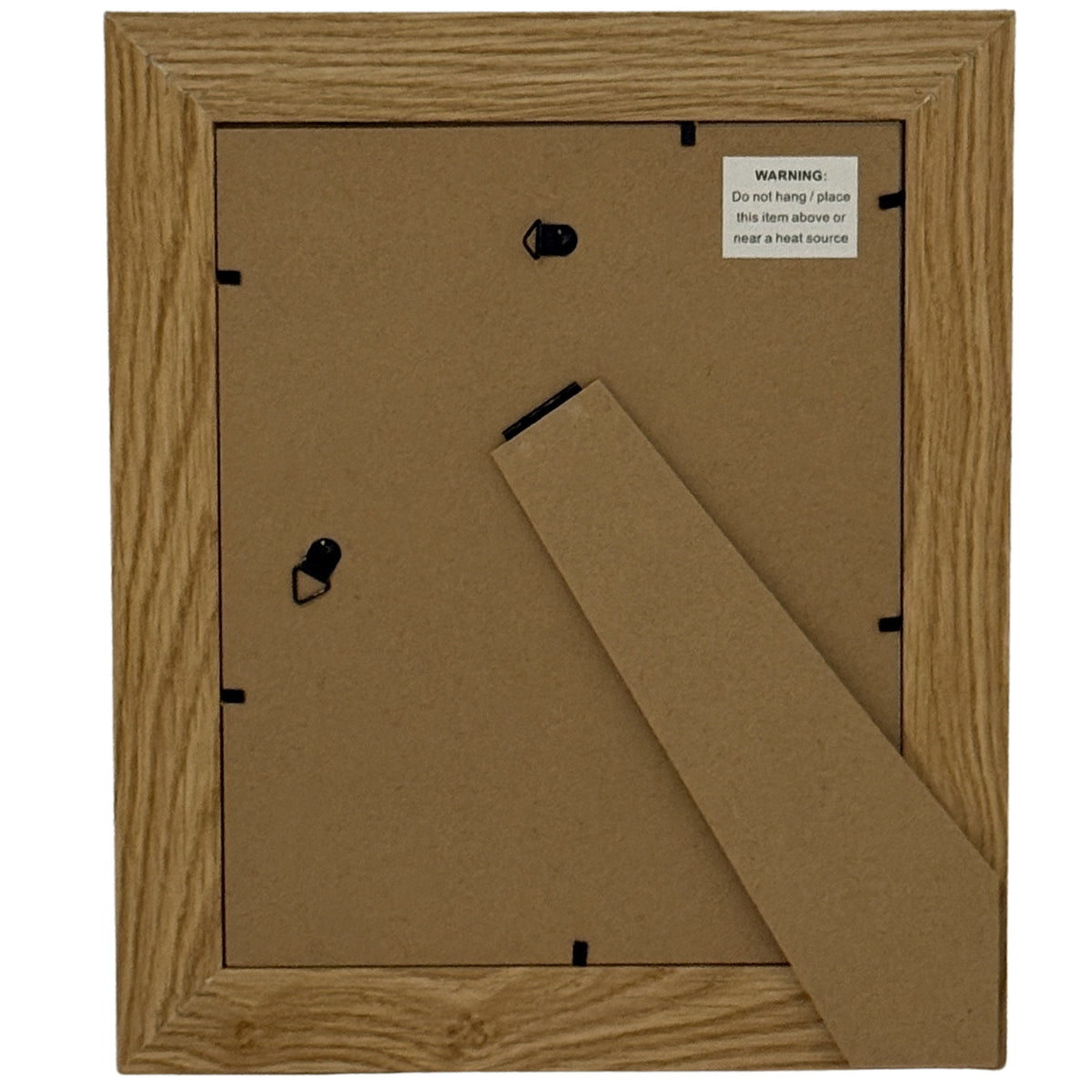 Rear view of the photo frame showing a brown back panel, fold-out stand, two hanging loops and a product label warning against placement above or near a heat source.