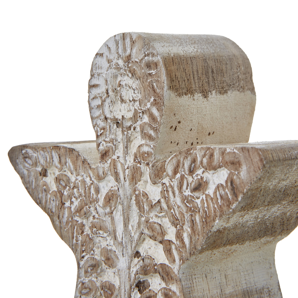 Close-up of the angel's rounded head and outspread wings, with distressed white wash around the floral and leaf relief.
