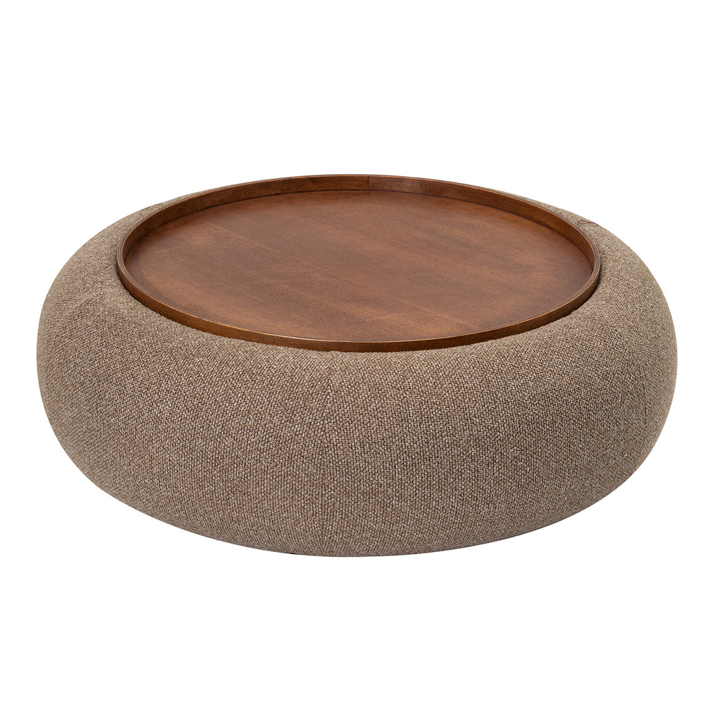 Elevated view showing the circular tray and its raised rim within the curved upholstered ottoman.