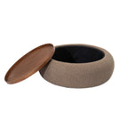 Coffee-coloured ottoman with its tray leaning against the left side and the circular storage opening fully exposed.